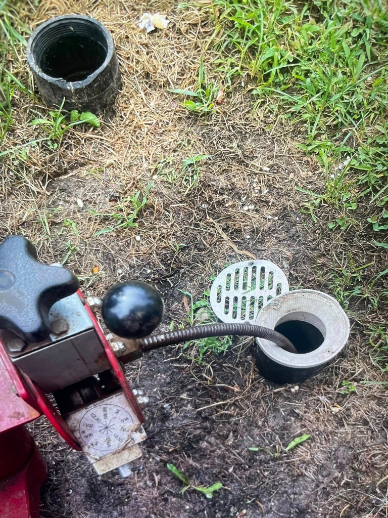 Spartan Tool cable machine cleaning a main sewer cleanout