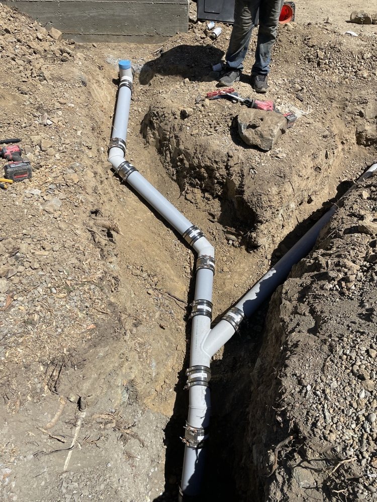 Trenching and installing new PVC sewer lines